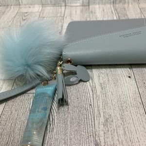 Baby blue keychain wallet with Broadway Argan Oil